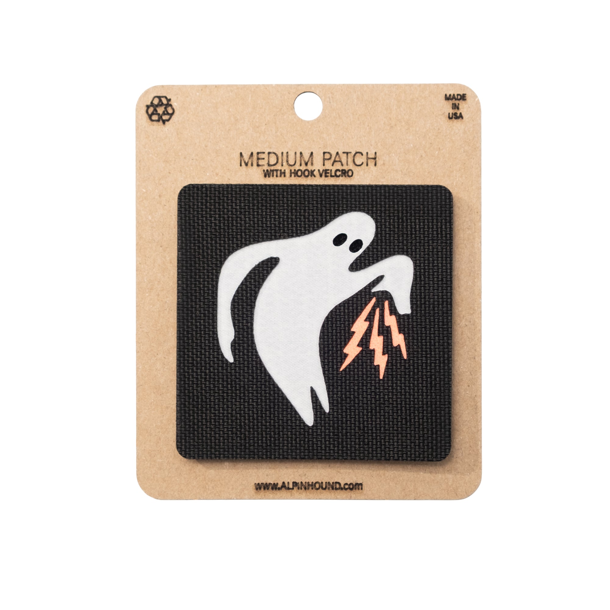 Ghost patch with lightning bolts on a cardboard backing with brand name.