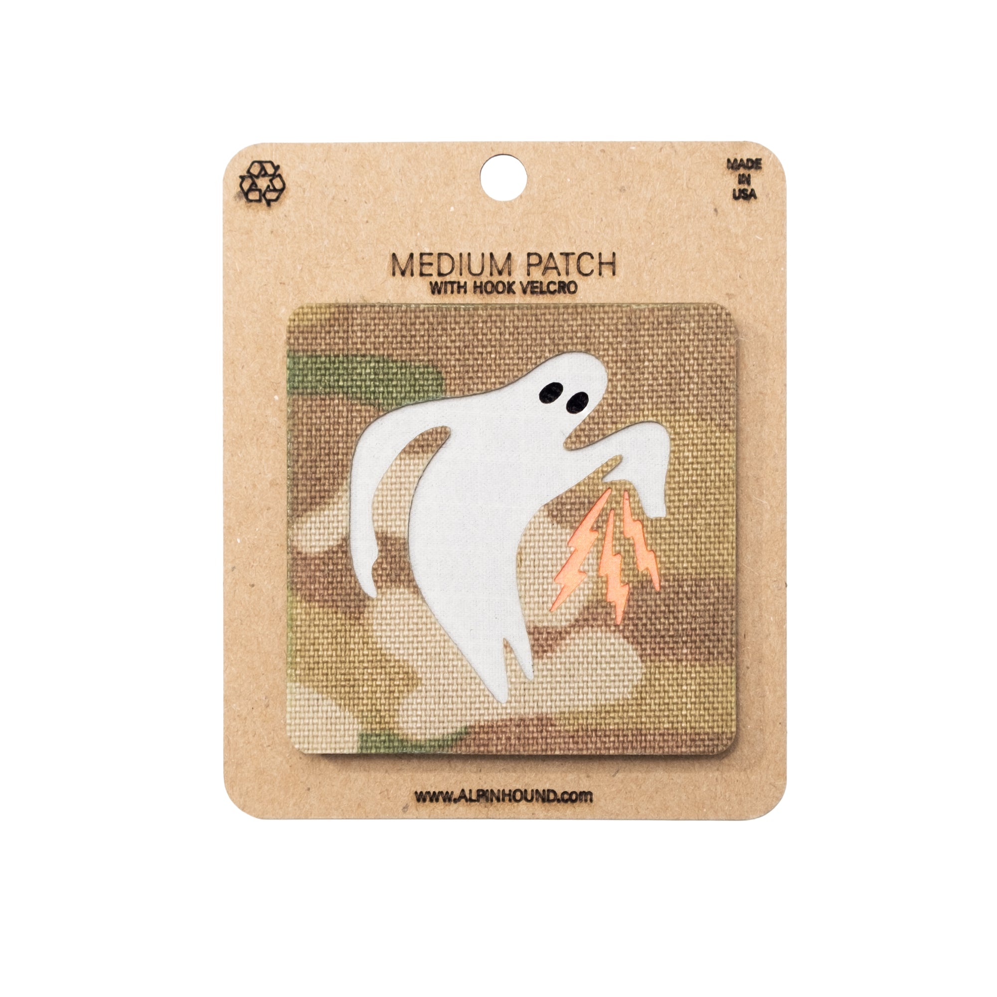 Ghost patch on a camouflage background with 'Made in USA' text on a brown card.