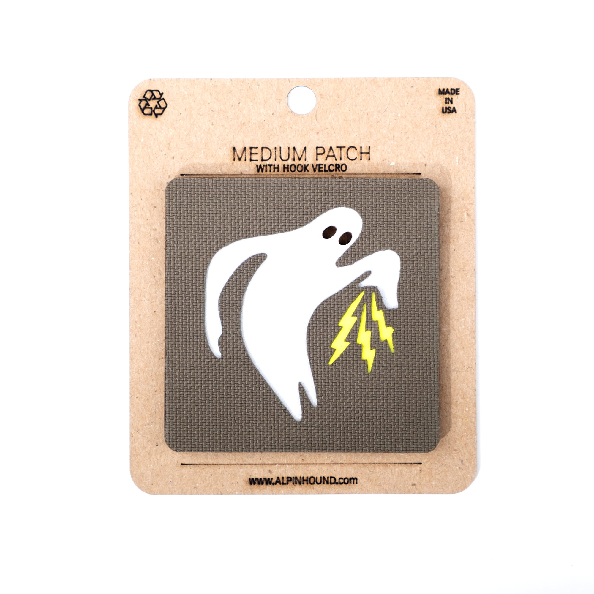 Ghost with lightning bolts patch on a cardboard backing with 'Alpinhound' branding.