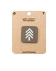 Mini Ranger Green patch with hook and velcro on a cardboard backing, featuring a white logo on a brown background.