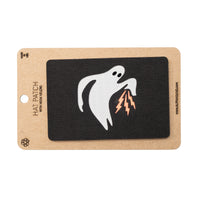 Ghost with lightning bolt patch on a black background with a brown card
