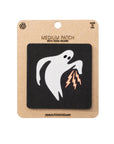 Ghost patch with lightning bolts on a cardboard backing with brand name.