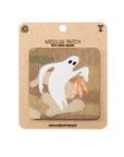 Ghost patch on a camouflage background with 'Made in USA' text on a brown card.