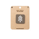 Mini Ranger Green patch with hook and velcro on a cardboard backing, featuring a white logo on a brown background.