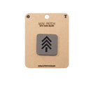 Mini patch with hook and velcro on a cardboard backing with branding information.